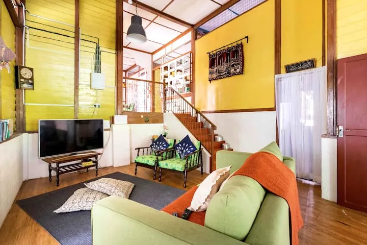 Warm timber living hall inside Laman Tamara